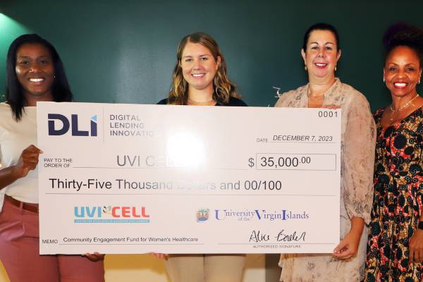 UVI and DLI representatives at the check presentation ceremony