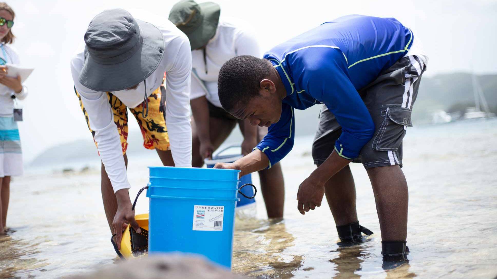 Students walking along the shoreline 