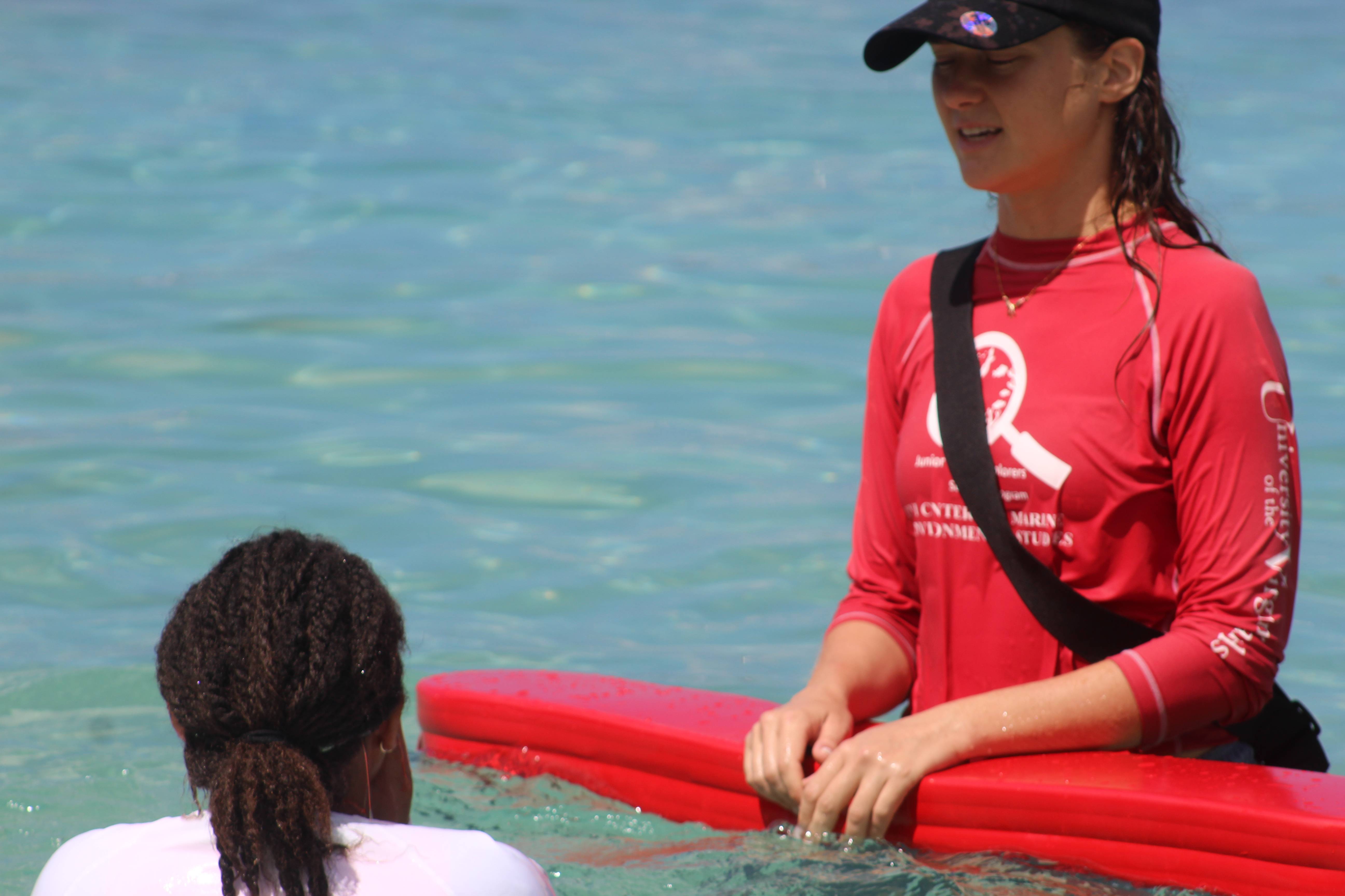 Water Safety Instructor Zoe assisting students 