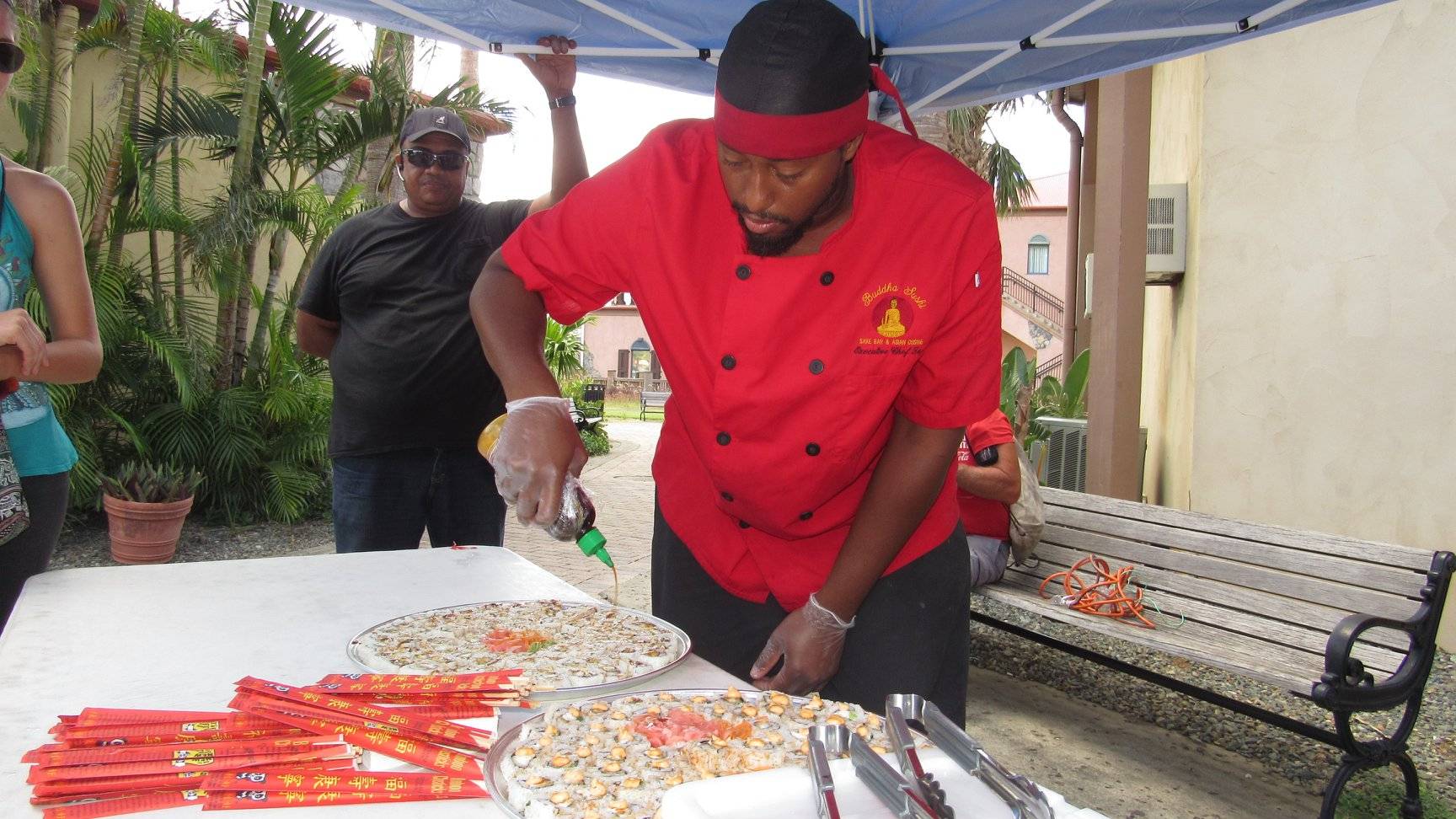 Chef Taj from Buddha Sushi serving lionfish sushi