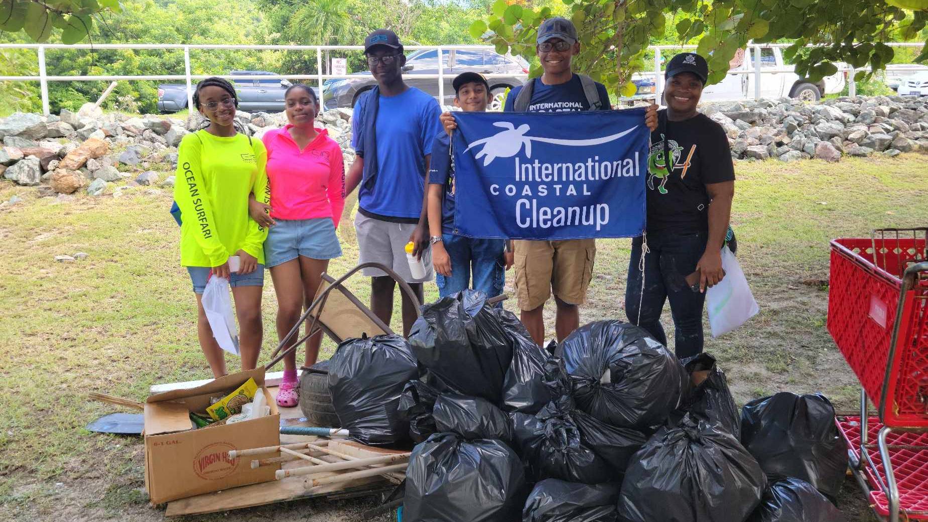 Students cleaning a beach