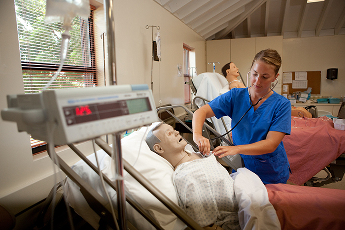 Nursing student practicing her nursing skills.