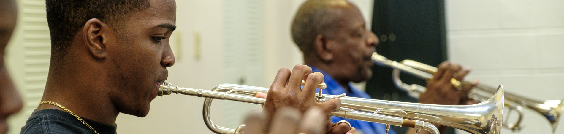 Student playing an instrument