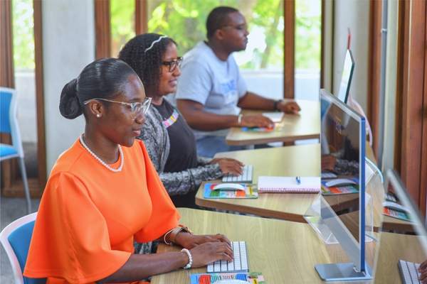 students on computers in the library