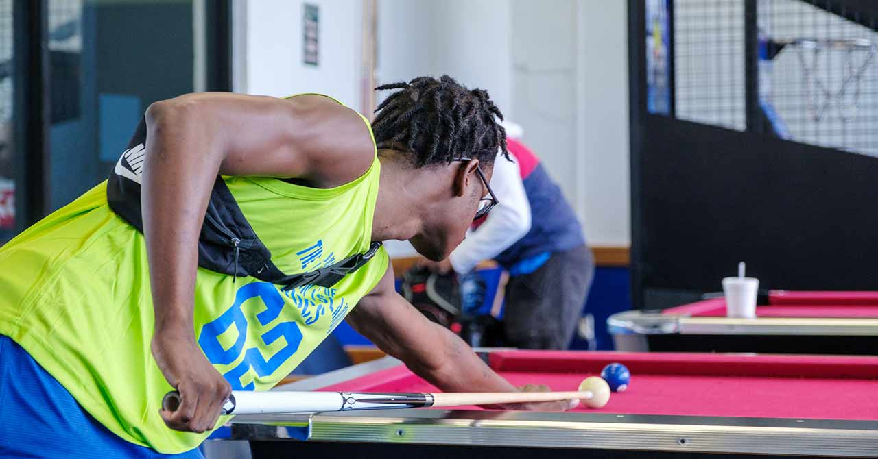 Student playing pool