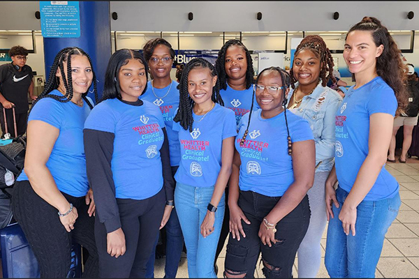 Jessica Pena, Bonika Bartlette, Candice Ennis, E'Yonna Crooke, Ketura Harrigan, Dalissa Lettsome Kishana Anselm and Michelle Laudat pose for photos at Cyril King Airport on Saint Thomas. 