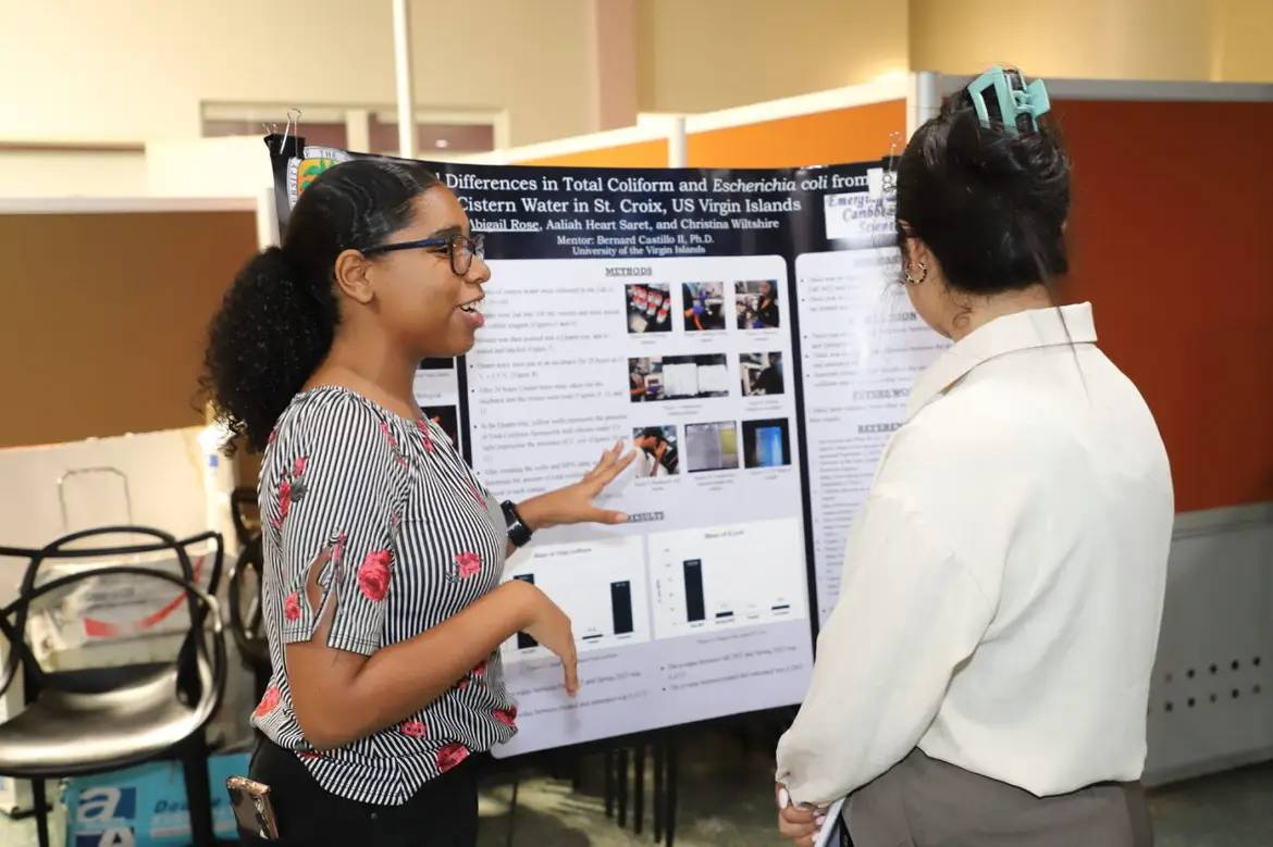 student presents findings on coli bacteria 